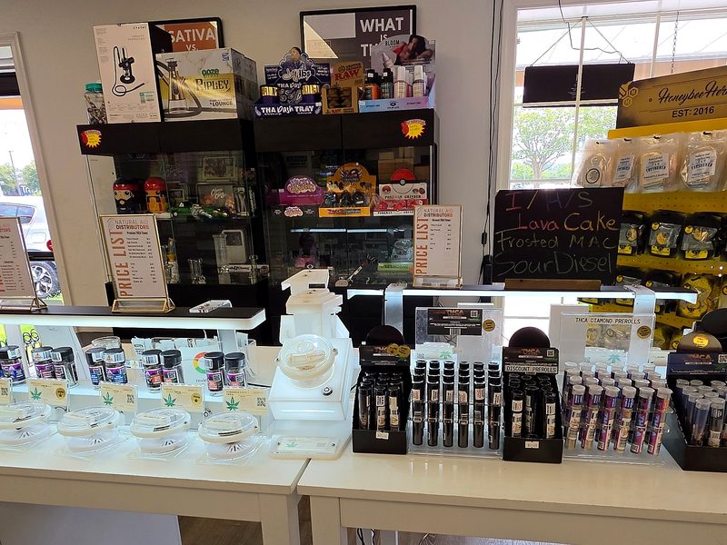 In-store display counter with flower jars, preroll displays and price lists